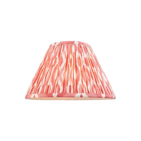 Endon Brenwell 30cm tapered lamp shade in pleated faux silk with coral pink and white ikat print and taped edging, shown on a plain white background.