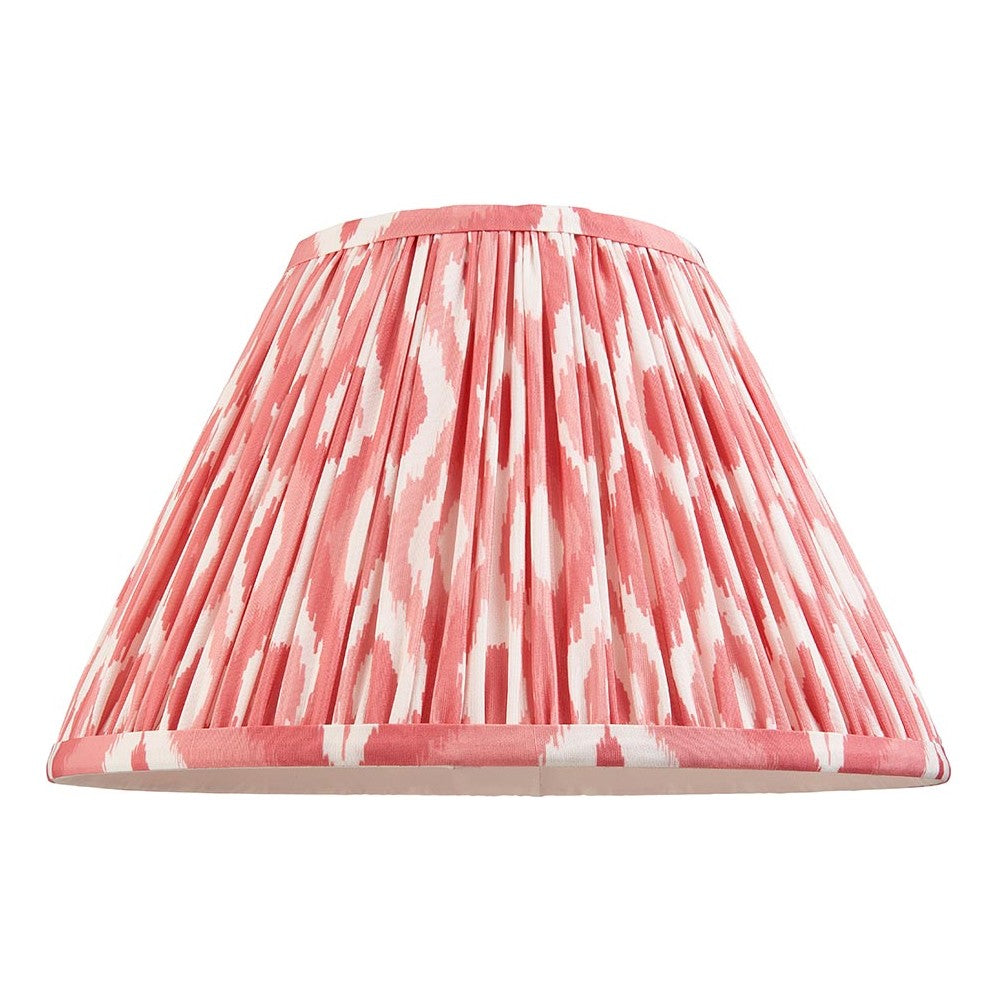 Endon Brenwell 30cm tapered lamp shade in coral pink and white ikat printed pleated faux silk with taped edges, shown on a plain white background.