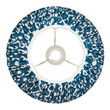 Top-down view of Endon Brenwell 30cm tapered lamp shade in marlin blue ikat printed faux silk with pleated gathers, taped edges and gimbal fitting.