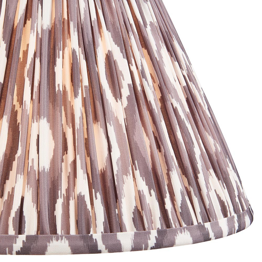 Close-up of Endon Brenwell 30cm tapered lamp shade in pearl grey, showing gathered pleated faux silk with a brown and cream ikat print.