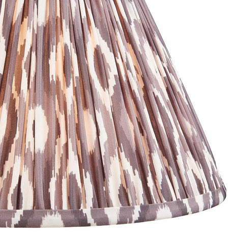 Close-up of Endon Brenwell 30cm tapered lamp shade in pearl grey, showing gathered pleated faux silk with a brown and cream ikat print.