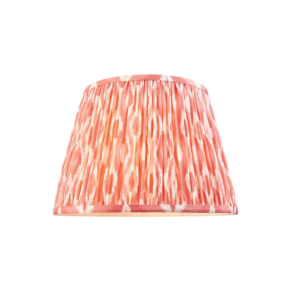 Endon Brenwell 35cm tapered lamp shade in pleated coral pink faux silk with ikat pattern and taped edges, shown on a plain white background.