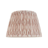 Endon Brenwell 35cm tapered lamp shade in neutral pleated faux silk with a pink and cream ikat print, shown on a plain white background.