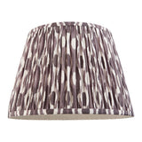 Endon Brenwell 35cm tapered lamp shade in pearl grey pleated faux silk with an ikat pattern in grey and white, shown on a plain background.