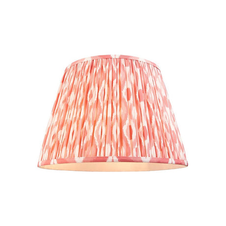 Endon Brenwell 40cm tapered lamp shade in pleated faux silk with coral pink and white ikat print and taped edges, shown on a plain white background.