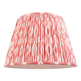 Endon Brenwell 40cm tapered lamp shade in coral pink and white ikat print on pleated faux silk with taped edges, shown on a plain white background.