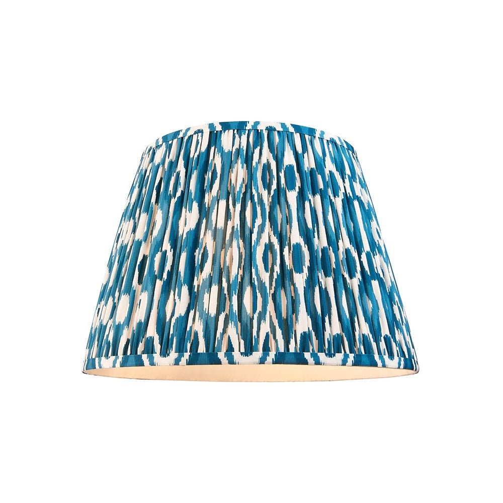 Endon Brenwell 40cm tapered lamp shade in marlin blue and white ikat printed pleated faux silk with taped edging, on a plain white background.