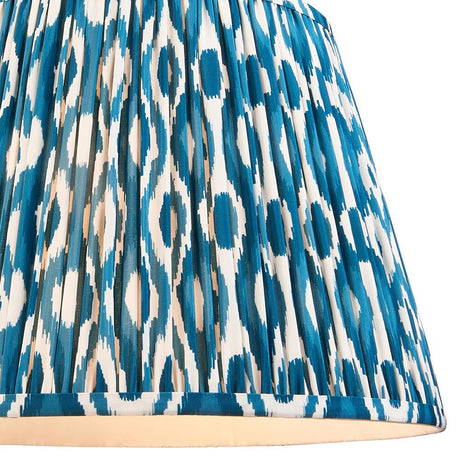Close-up of the Endon Brenwell 40cm tapered lamp shade in marlin blue, showing the pleated faux silk with a blue and white ikat print.