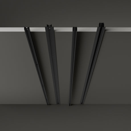 Brillia 3m recessed 1-phase lighting track in black, shown as four angled rail sections hanging from a slim ceiling slot against a plain grey background.