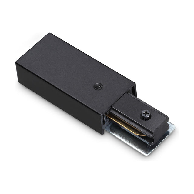 Brillia Surface 1-Phase Track Power Feed in black, a compact rectangular housing with a slimmer connector end and visible screw fixings, shown on a plain white background.