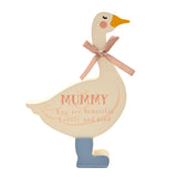 Cream MDF goose-shaped wall plaque with "MUMMY" and a loving message in pink text, pink ribbon bow, orange beak, and one blue boot, on a white background.