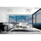Modern living room with large windows and minimalist white furniture, featuring the Bucle Dimmable LED Floor Lamp 50W 3000K in Silver & Chrome. Text reads: bucle series by mantra and ...siente le luz.