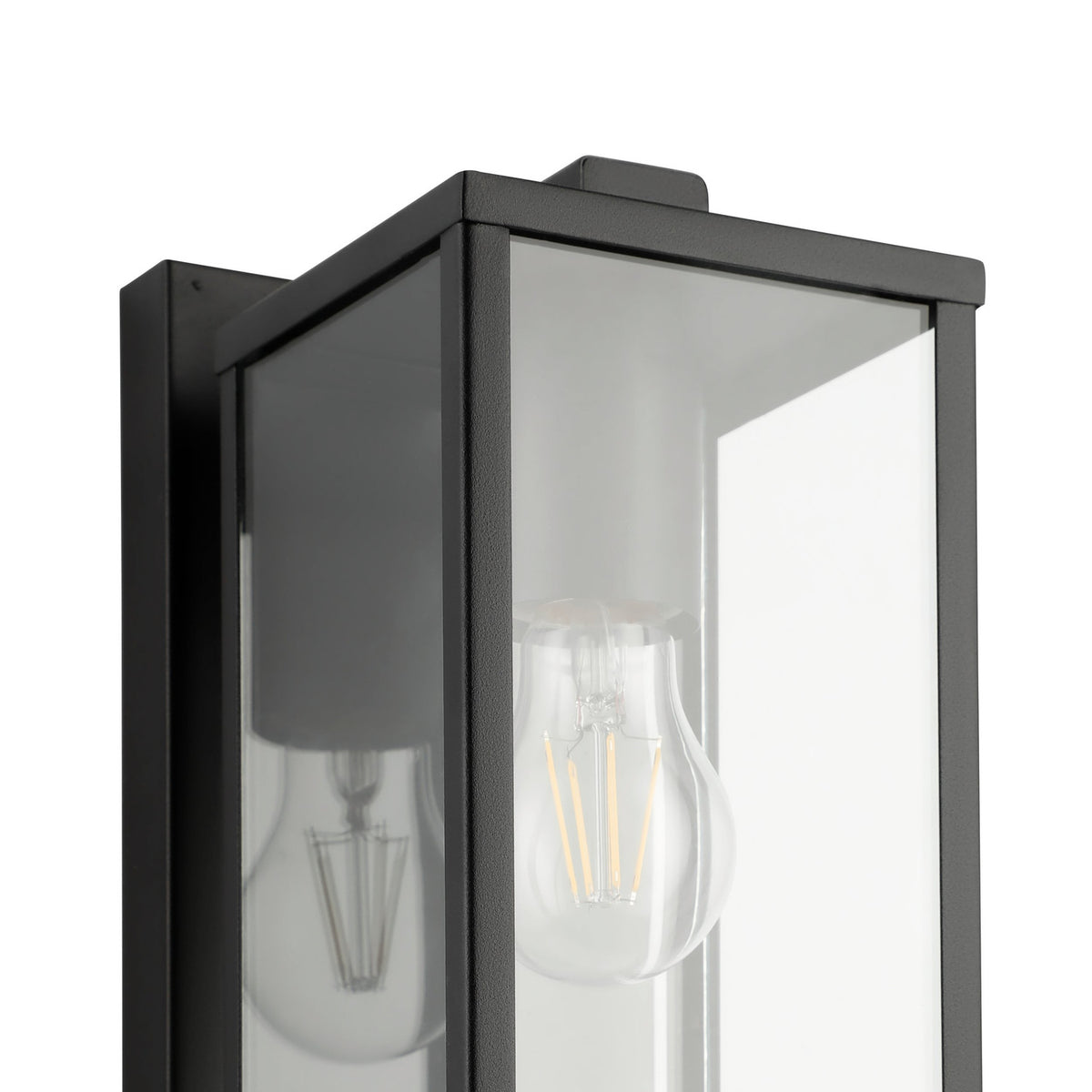 Close-up of the Budrone outdoor wall light in black steel with a box lantern frame, clear glass panels and visible E27 bulb, shown against a plain white background.