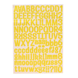 Yellow alphabet sticker sheet with upper and lower case letters, numbers and punctuation for personalising the money box, shown on a plain background.