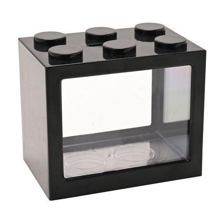 Black plastic brick-shaped money box with six round studs on top and a clear front window, shown with two coin dishes inside on a white background.