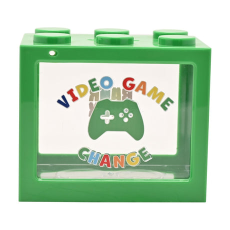 Green plastic building block money box with six top studs and a clear front window showing coins, printed with "Video Game Change" and a game controller graphic.