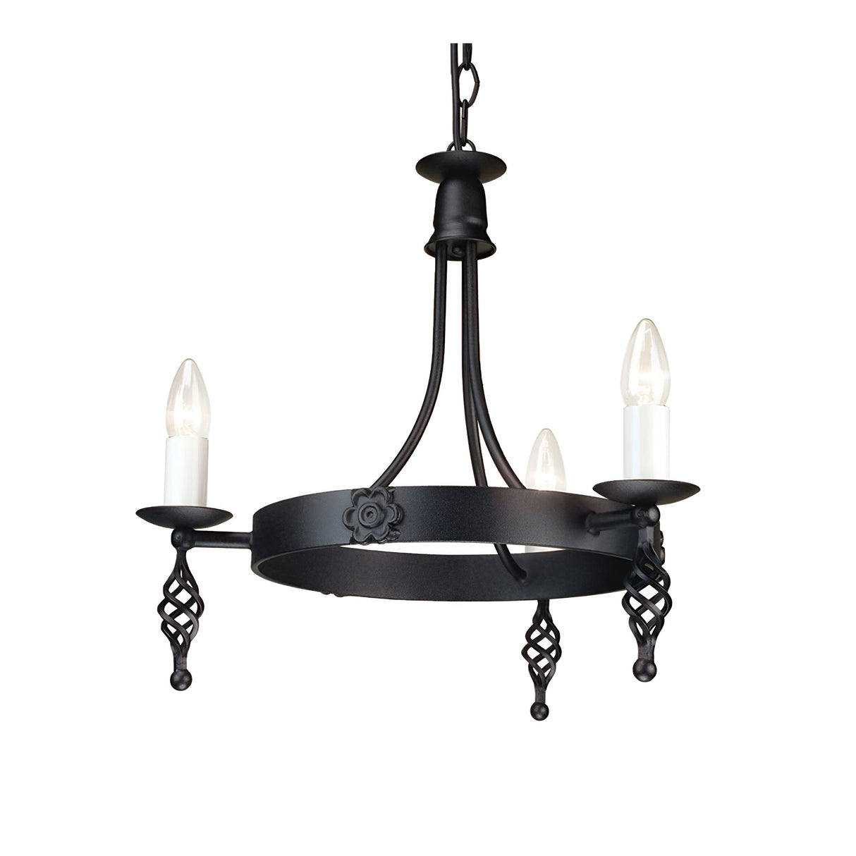 The Belfry 3 Light Chandelier - Black showcases medieval craftsmanship with its black metal design. It features three candle-shaped bulbs resting on spiral holders, all suspended from a hand-forged metal frame adorned with decorative floral details and a sturdy chain attachment.