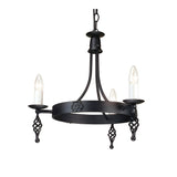 The Belfry 3 Light Chandelier - Black showcases medieval craftsmanship with its black metal design. It features three candle-shaped bulbs resting on spiral holders, all suspended from a hand-forged metal frame adorned with decorative floral details and a sturdy chain attachment.