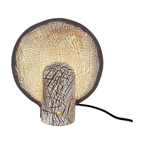 Cagliari ceramic table lamp in black clay, with a round upright dish shade and rounded stem both showing white crackle glaze, brass button detail, on a plain white background.