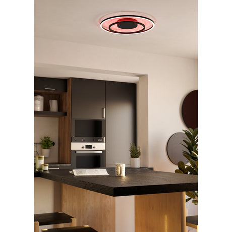 Calagrano Smart LED Flush Ceiling Light, 45cm round black fixture with concentric rings glowing red, mounted above a kitchen island in a modern dark-cabinet kitchen.