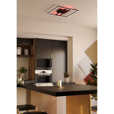 Calagrano Smart Colour Changing LED Panel Light in black, square ceiling fixture with white outer frame and red-lit central bar, shown flush-mounted above a kitchen island.