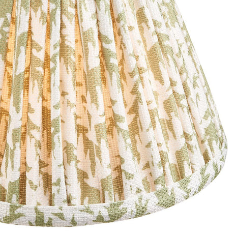 Endon Caldgrove 16cm tapered lamp shade in herb garden green, close-up of the pleated faux linen with leaf print and taped edge trim.