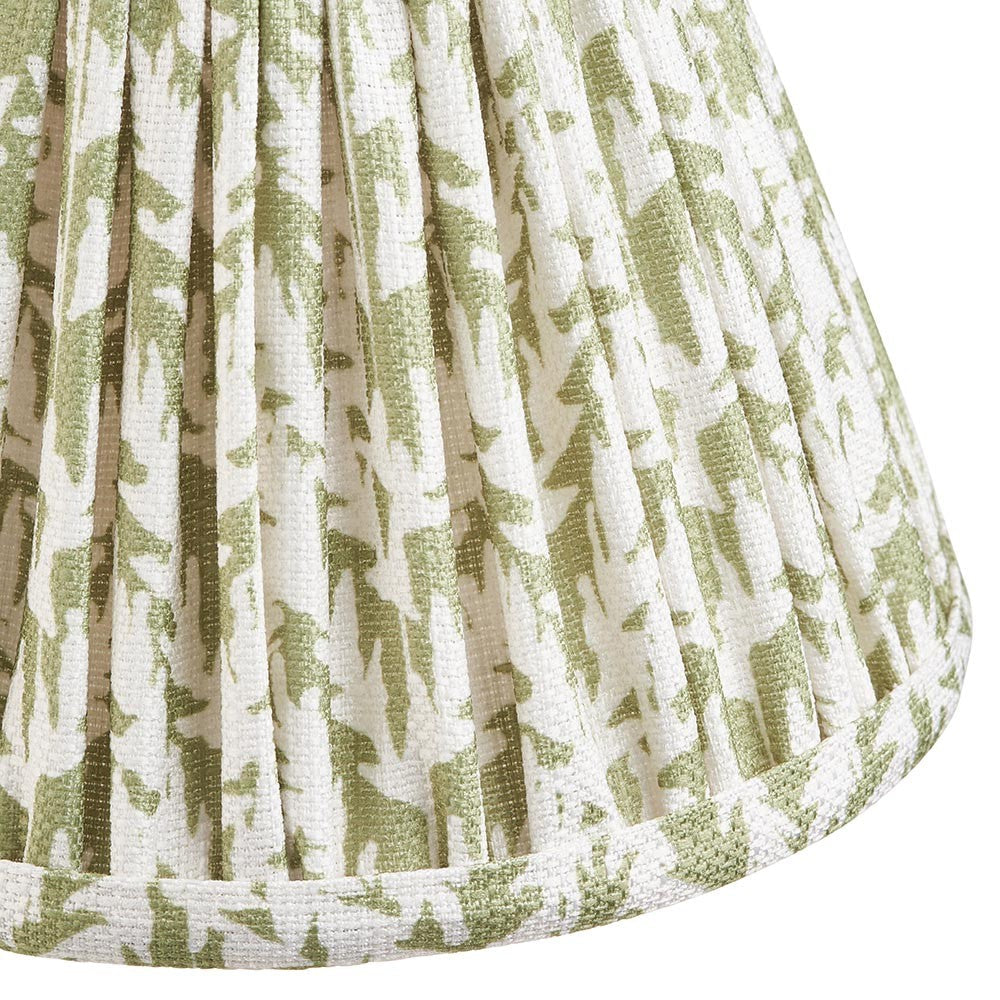 Close-up of the Endon Caldgrove 16cm tapered lamp shade in herb garden green, showing pleated faux linen with a leaf print and taped lower edge.