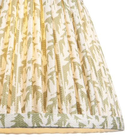 Endon Caldgrove 20cm tapered lamp shade in herb garden green, close-up of the pleated faux linen with botanical leaf print and taped edge trim.