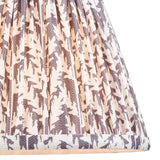 Endon Caldgrove 20cm tapered lamp shade in pearl grey, shown close-up with gathered pleats and a botanical leaf print on faux linen with taped edging.
