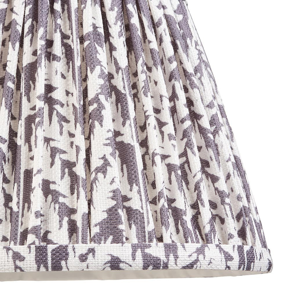 Endon Caldgrove 20cm tapered lamp shade in pearl grey, close-up of the pleated faux linen with a printed leaf pattern and taped bottom edge.