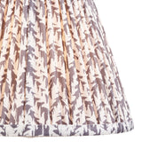 Close-up of Endon Caldgrove 25cm tapered lamp shade in pearl grey, showing gathered pleated faux linen with a soft botanical leaf print and taped edge.