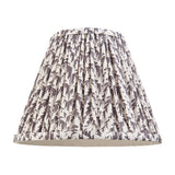 Endon Caldgrove 25cm tapered lamp shade in pearl grey pleated faux linen with a leaf print and taped edges, on a plain white background.
