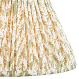 Close-up of Endon Caldgrove 30cm tapered lamp shade in herb garden green, showing pleated faux linen with a botanical leaf print and taped edge.