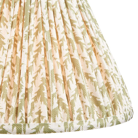 Close-up of Endon Caldgrove 30cm tapered lamp shade in herb garden green, showing pleated faux linen with a botanical leaf print and taped edge.
