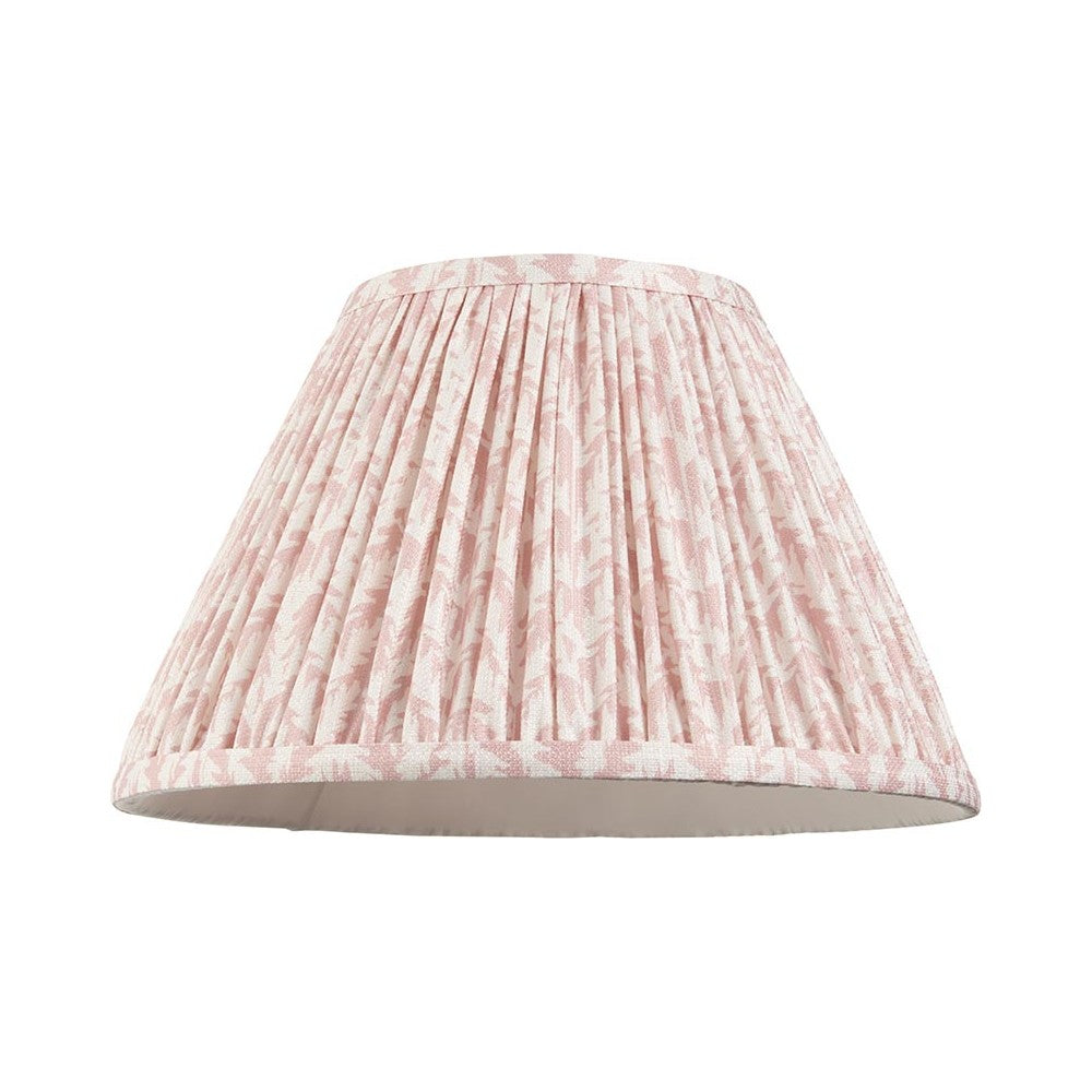 Endon Caldgrove 30cm tapered lamp shade in peachy keen pink faux linen with a pleated leaf print and taped edge, shown on a plain white background.