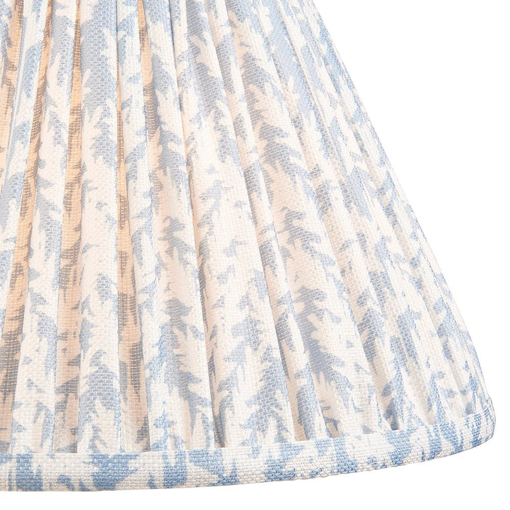 Endon Caldgrove 30cm tapered lamp shade in shell bay blue, shown close-up with pleated faux linen and a soft leaf print in blue and white tones.