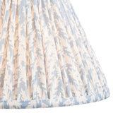 Endon Caldgrove 30cm tapered lamp shade in shell bay blue, shown close-up with pleated faux linen and a soft leaf print in blue and white tones.