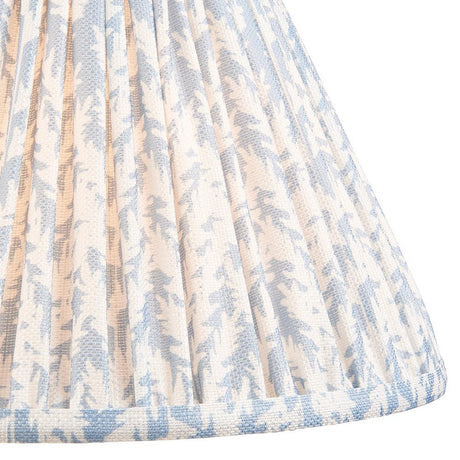 Endon Caldgrove 30cm tapered lamp shade in shell bay blue, shown close-up with pleated faux linen and a soft leaf print in blue and white tones.