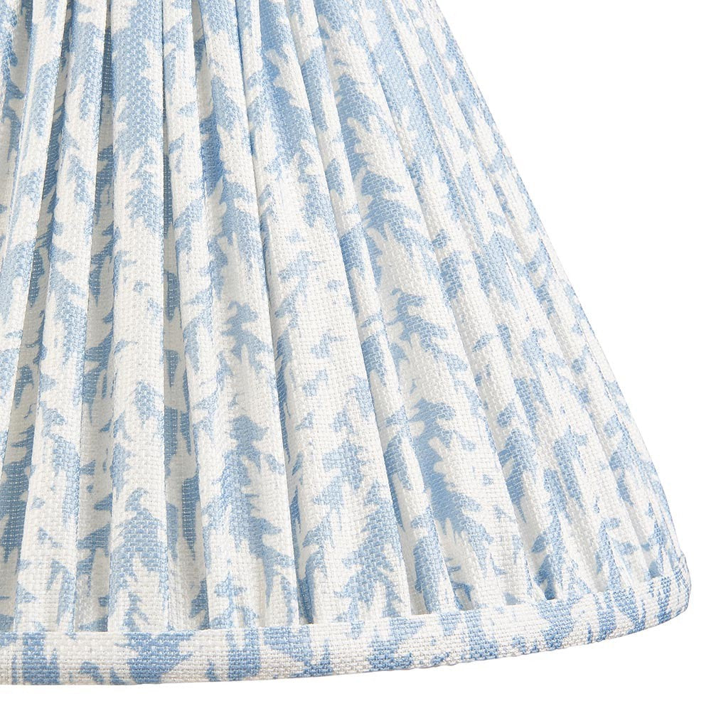 Close-up of Endon Caldgrove 30cm tapered lamp shade in shell bay blue, showing pleated faux linen with a soft botanical leaf print.