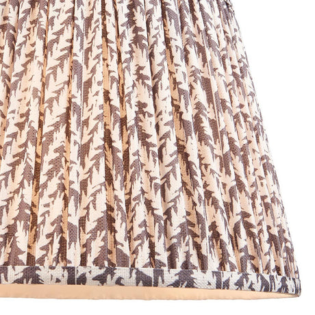 Endon Caldgrove 35cm tapered lamp shade in pearl grey faux linen, close-up of the pleated leaf-print fabric with taped edge detailing along the bottom.