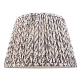 Endon Caldgrove 35cm tapered lamp shade in pearl grey pleated faux linen with a botanical leaf print and taped edging, on a plain white background.