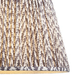 Endon Caldgrove 40cm tapered lamp shade in pearl grey, shown in close-up with gathered pleats, taped edge trim and a subtle leaf print on faux linen.