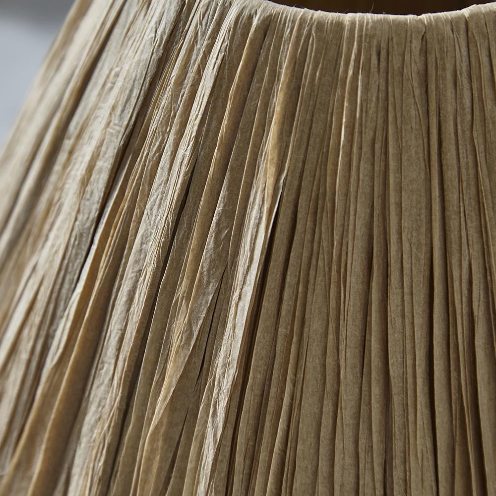 Close-up of the Caldwood 25cm tapered lamp shade in natural raffia, showing hand-wrapped woven texture in an earthy brown tone.