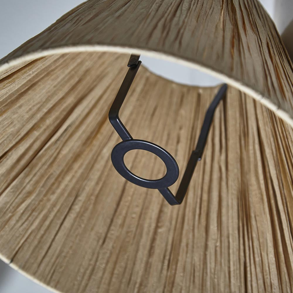 Close-up of the Caldwood 25cm tapered lamp shade in natural raffia, showing the woven texture and black fixed gimbal fitting inside.