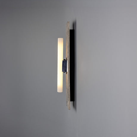 Capua Ceramic Wall Light in marbled glaze with matt black metalwork, slim upright panel and central tube bulb lit, mounted on a grey wall.