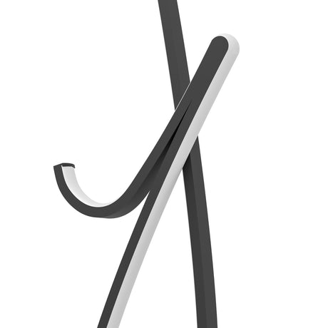 Close-up of the Cardoncito LED floor lamp's crossed black steel frame with a white plastic diffuser edge and curled hooked tail, shown against a plain white background.