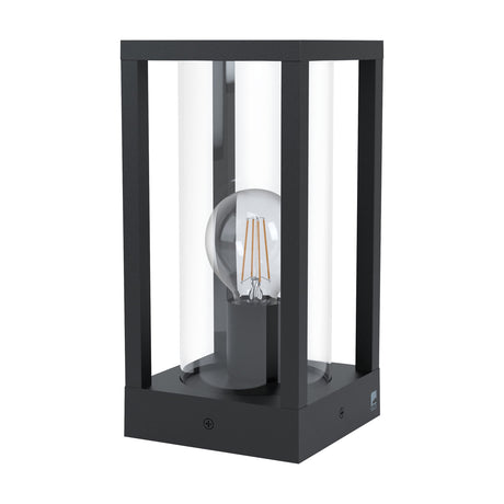 Cascinetta square outdoor post light in black cast aluminium, with slim corner uprights, clear glass cylinder, and E27 bulb visible, shown on a plain white background.