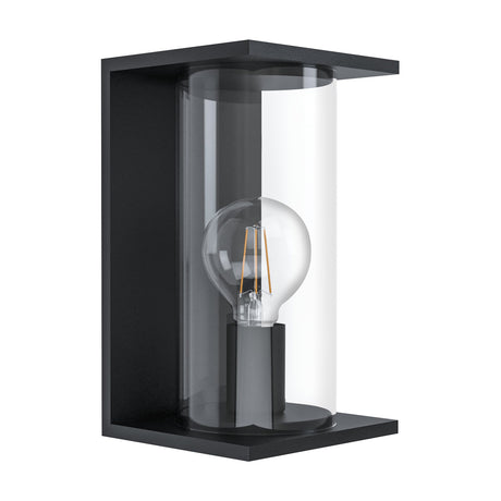 Cascinetta outdoor wall light with a black rectangular steel frame open at the sides, clear glass cylinder, and exposed E27 bulb, shown on a plain white background.