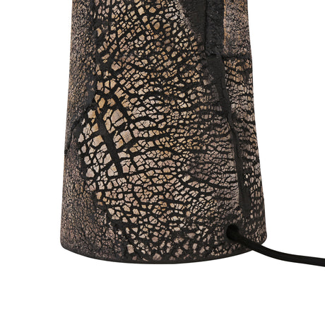 Close-up of the Cassia Ceramic Mushroom Table Lamp's tapered black clay base, showing a dark crackled texture with pale veined patterns, against a white background.