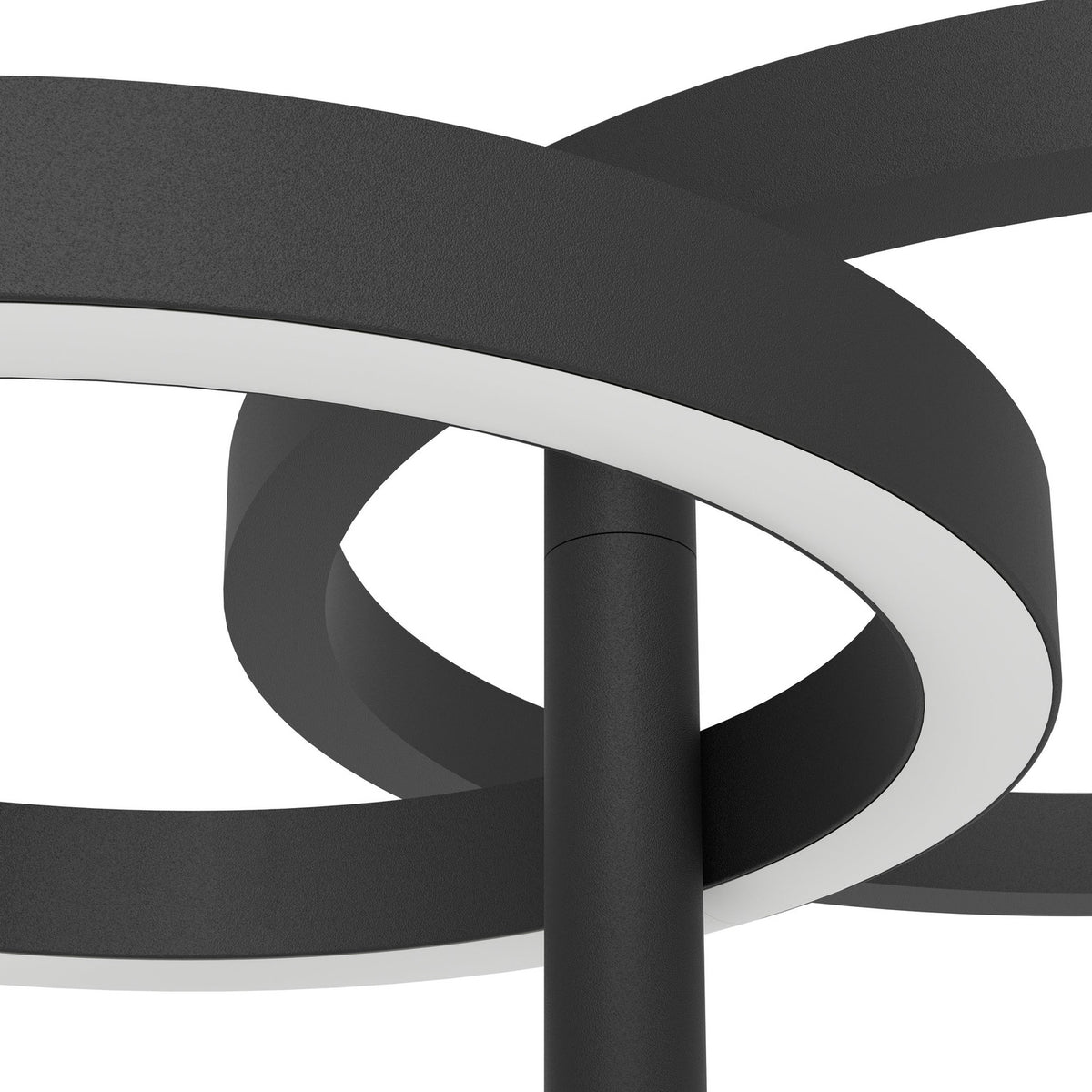 Close-up of the Castelpoto 1 LED floor lamp in black, showing intersecting steel rings with white plastic shades around the central pole on a plain background.